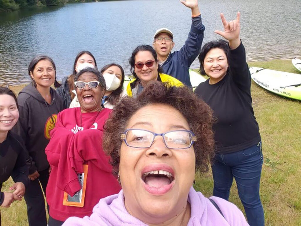 Pam Slaughter takes a selfie with several people on a People of Color Outdoors outing.