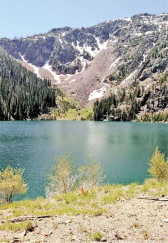 A lake next to a mountain in spring