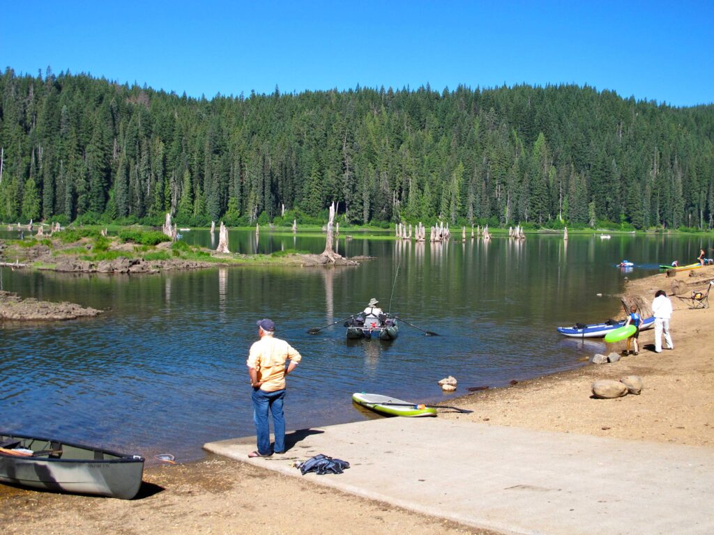 People putting various watercrafts into Goose Lake